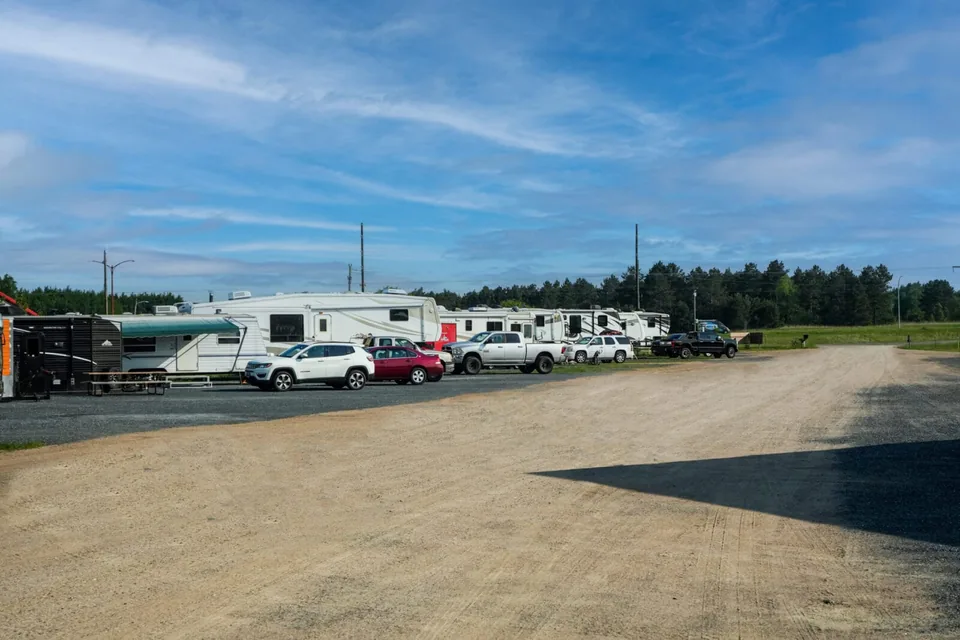 RVs parked along the spacious gravel sites at Grant Haven Campground